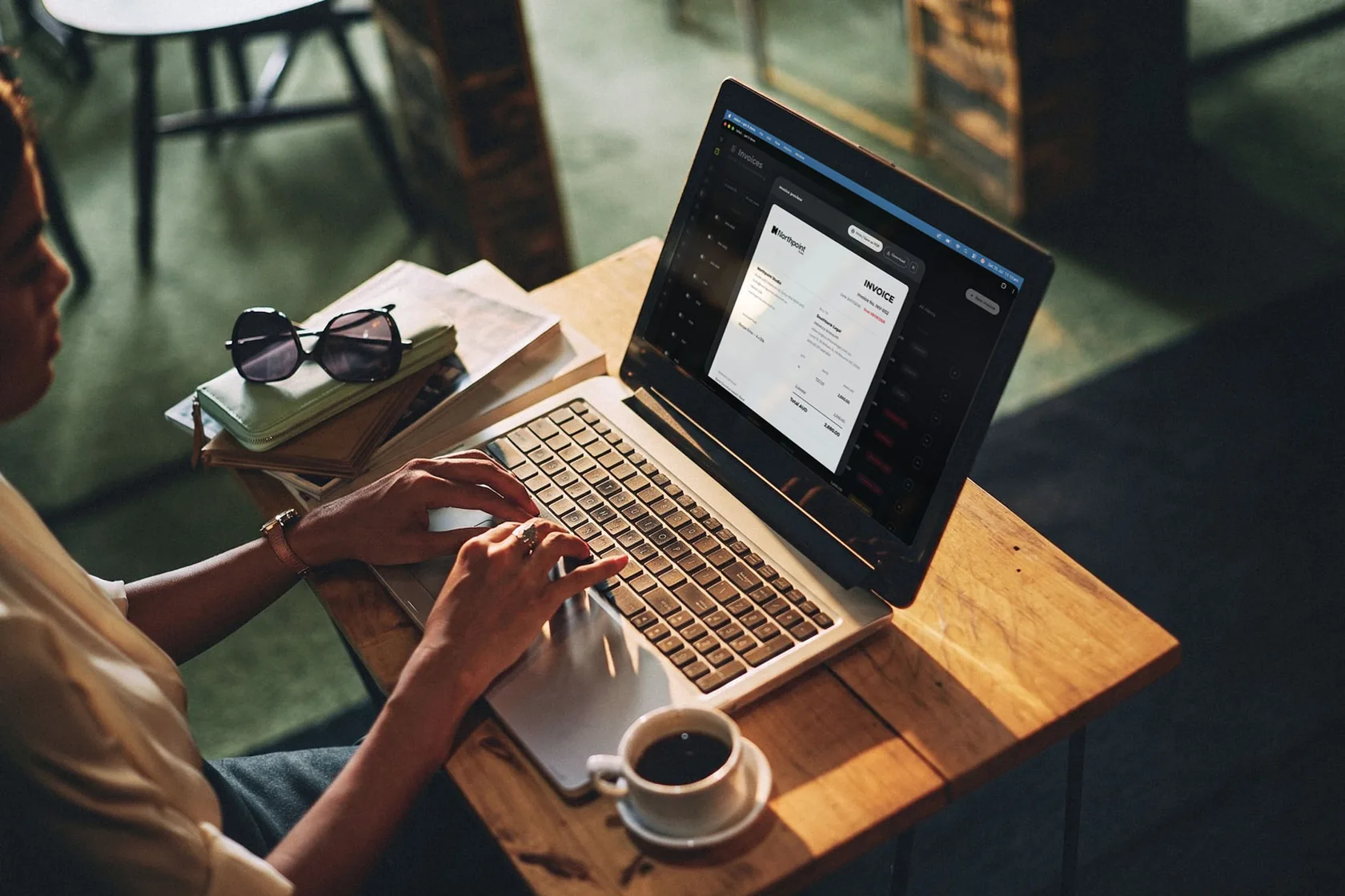 A billed invoice open on a laptop, ready to send as a clean branded PDF