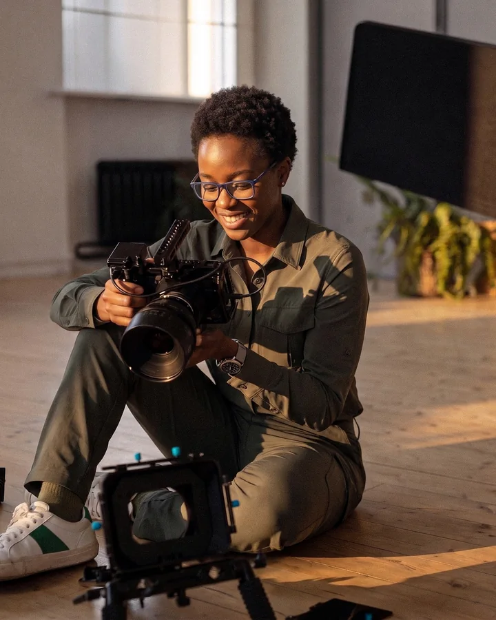 A filmmaker with a cinema camera on a studio floor